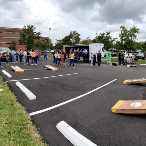 Philly yard Bar in parking lot surrounded by cornhole