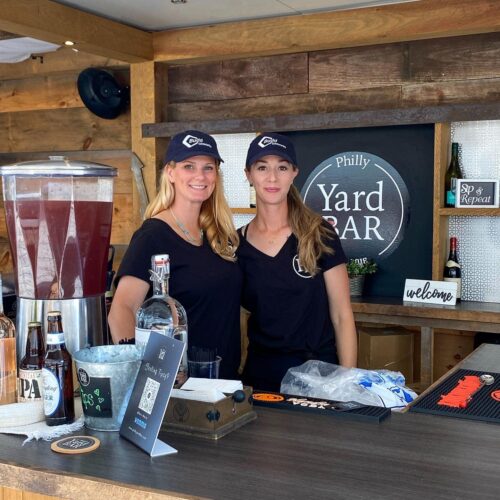 Mobile Bar Rental Service 2 Bar Tenders posing behind Philly Yard Bar
