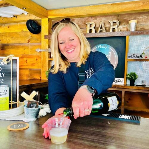 Mobile Bar Rental Service 3 Owner pouring champagne behind Philly Yard Bar