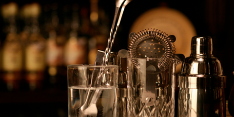 Philly Yard Bar March 2023 pic, showcase of muddler, glass, and shaker, blurred background