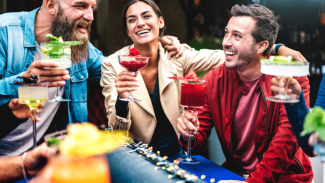Group of Adults enjoying cocktails outside