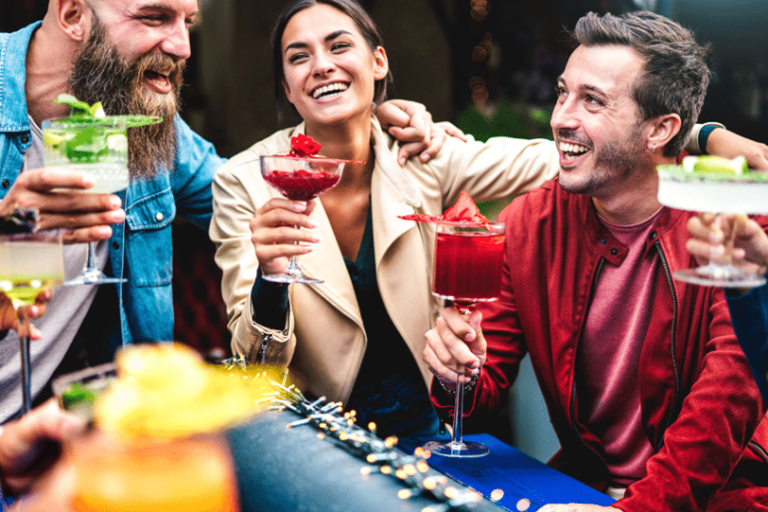 Group of Adults enjoying cocktails outside